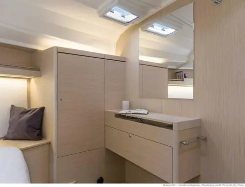 Slide: The Image of Interior of 2026 Beneteau Oceanis 40.1 yacht, featuring modern wood cabinetry and sleek design. - 30