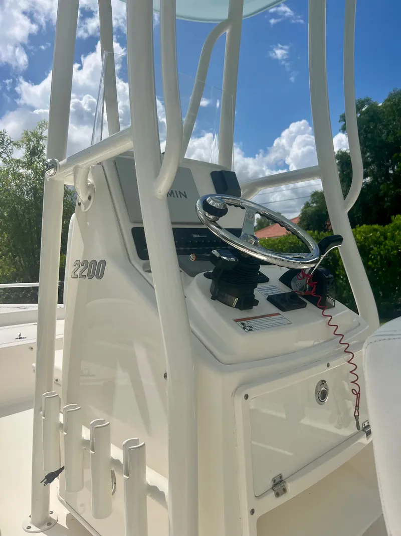 Slide: The Image of 2020 Pathfinder 2200 TRS boat console with steering wheel and Garmin GPS. - 17