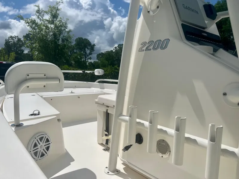 Slide: The Image of 2020 Pathfinder 2200 TRS boat interior with seating and rod holders. - 18