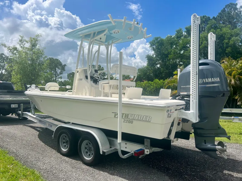 Slide: The Image of 2020 Pathfinder 2200 TRS boat on trailer with Yamaha outboard motor. - 21