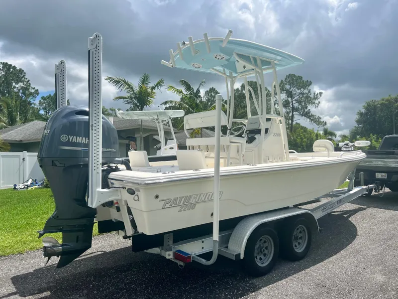 Slide: The Image of 2020 Pathfinder 2200 TRS boat on trailer with Yamaha outboard motor. - 22