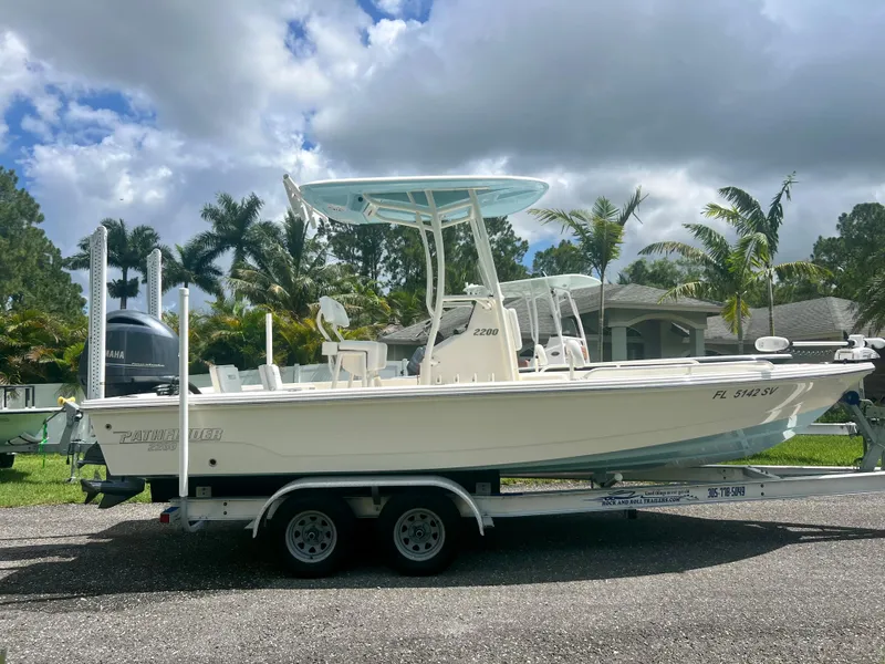 Slide: The Image of 2020 Pathfinder 2200 TRS boat on a trailer, parked outdoors. - 4