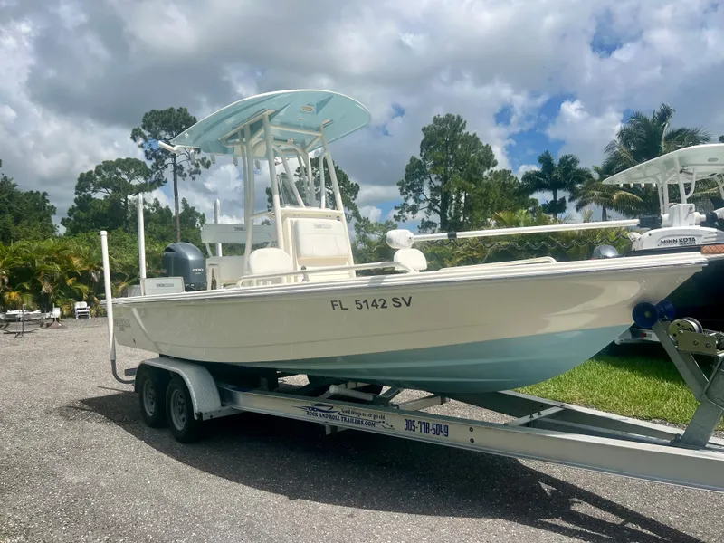 Slide: The Image of 2020 Pathfinder 2200 TRS boat on a trailer in a parking lot. - 5