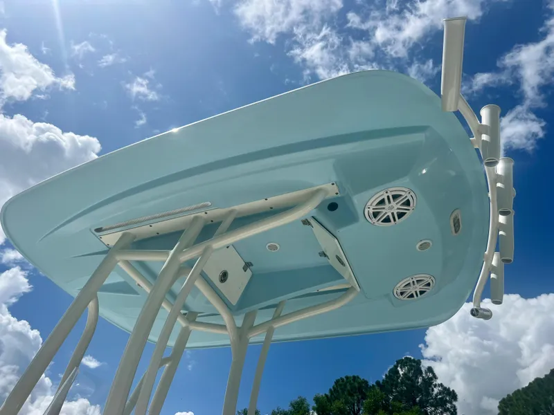 Slide: The Image of 2020 Pathfinder 2200 TRS boat underside against blue sky and clouds. - 9