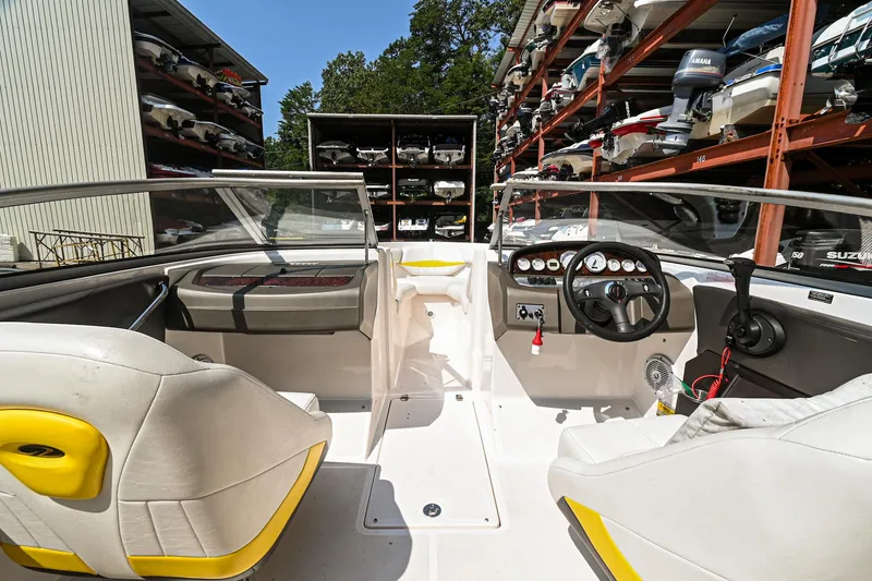 Slide: The Image of 2006 Regal 2000 Bowrider interior with dual seats and dashboard. - 10