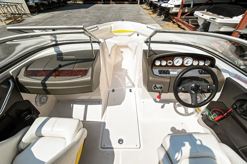 Slide: The Image of 2006 Regal 2000 Bowrider boat interior with dashboard and seating. - 14