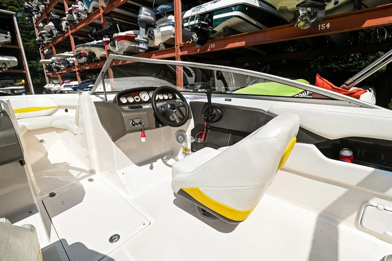 Slide: The Image of 2006 Regal 2000 Bowrider interior with steering wheel and seating. - 15