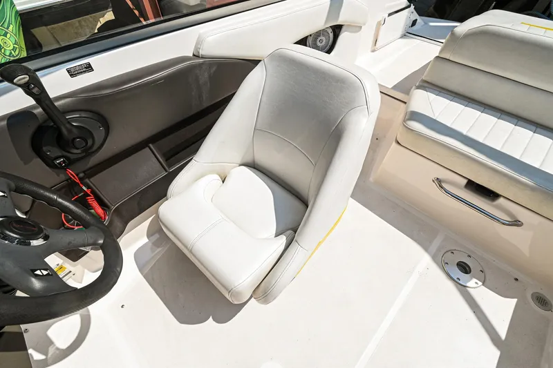 Slide: The Image of 2006 Regal 2000 Bowrider interior with white captain's chair and steering wheel. - 18