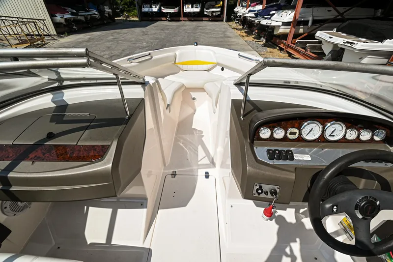 Slide: The Image of 2006 Regal 2000 Bowrider boat interior with dashboard and seating area. - 19