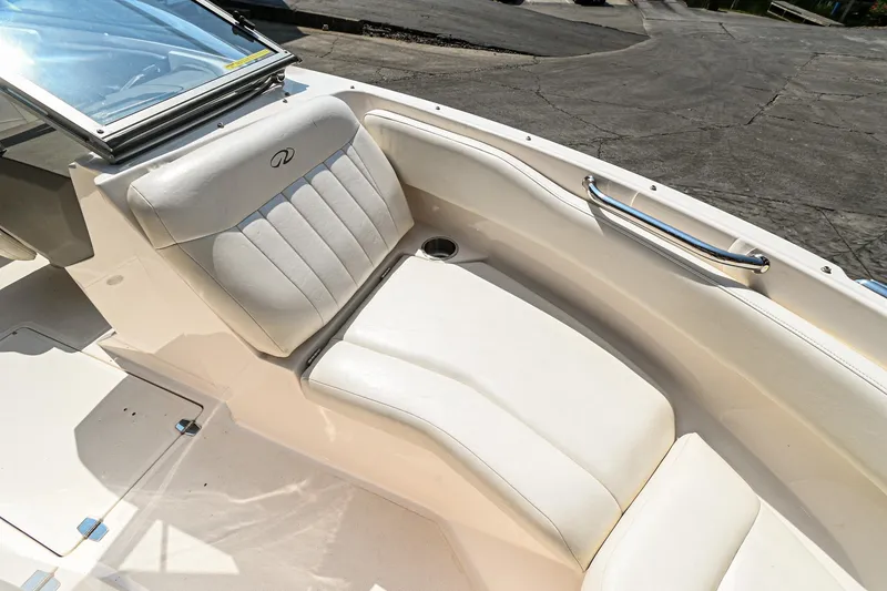 Slide: The Image of 2006 Regal 2000 Bowrider boat interior with white leather seating. - 21