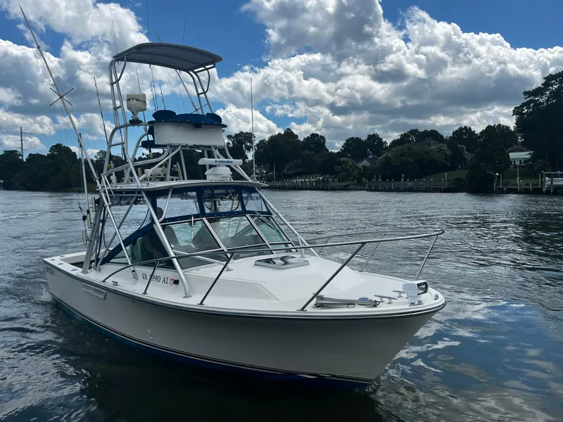 Slide: The Image of 1988 NorthCoast 24 Express Sportfish boat on calm water under cloudy sky. - 10
