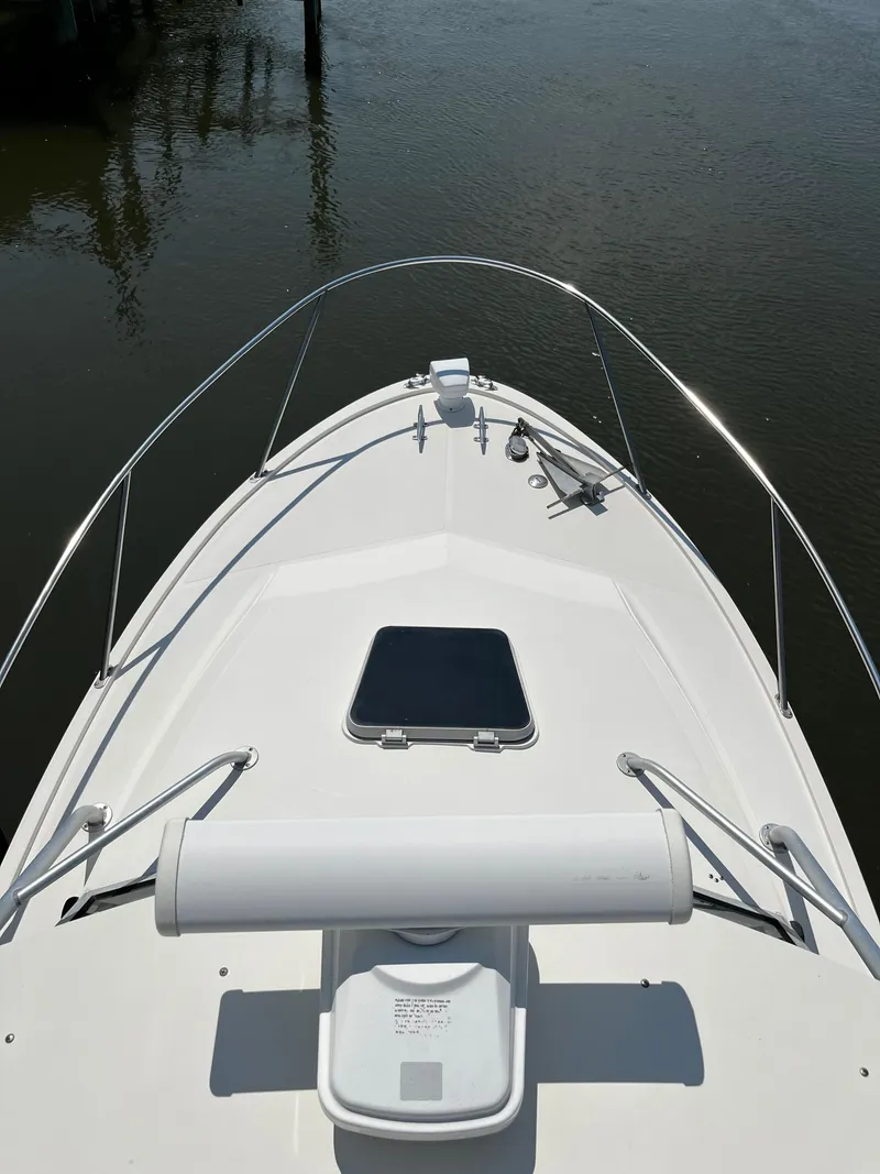 Slide: The Image of 1988 NorthCoast 24 Express Sportfish boat bow view on calm water. - 13