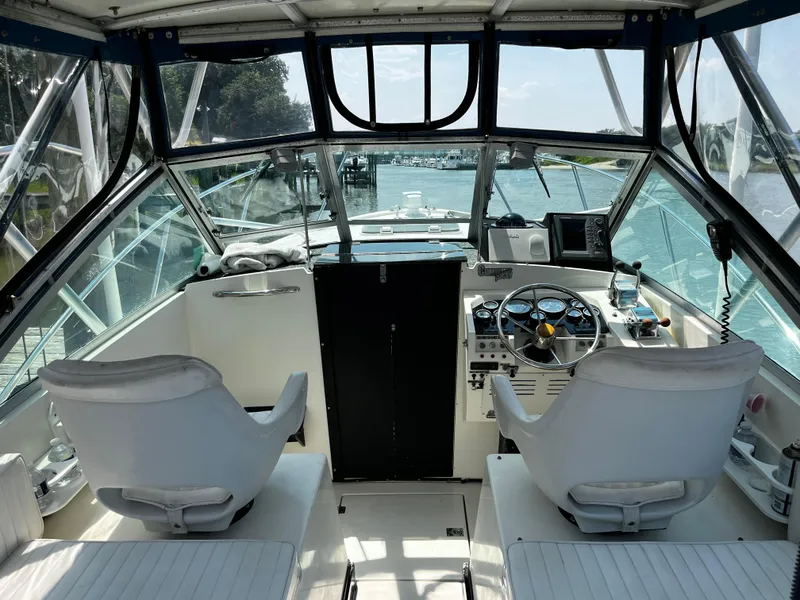 Slide: The Image of Interior view of 1988 NorthCoast 24 Express Sportfish boat cockpit with steering wheel and controls. - 15