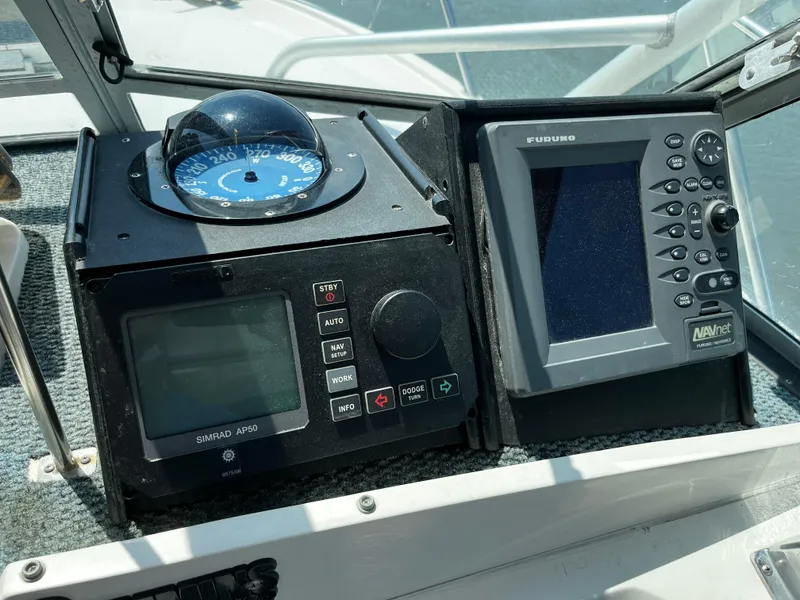 Slide: The Image of Dashboard of a 1988 NorthCoast 24 Express Sportfish with navigation instruments. - 17
