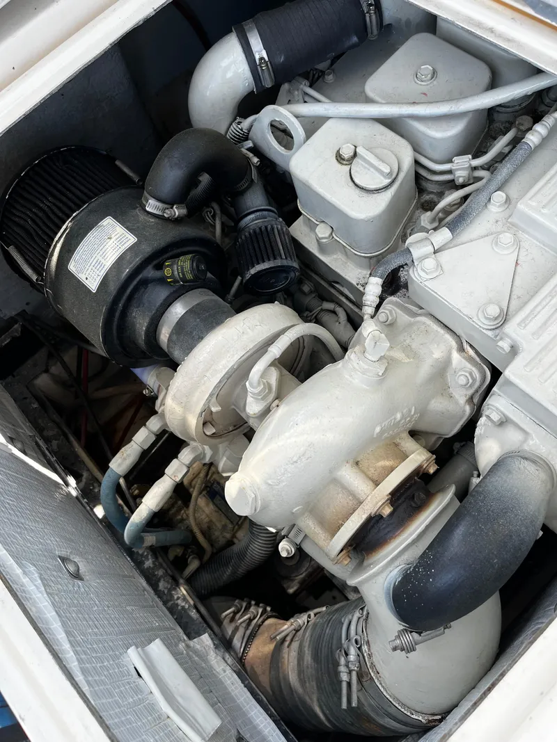 Slide: The Image of Engine of a 1988 NorthCoast 24 Express Sportfish boat, showcasing mechanical components. - 25