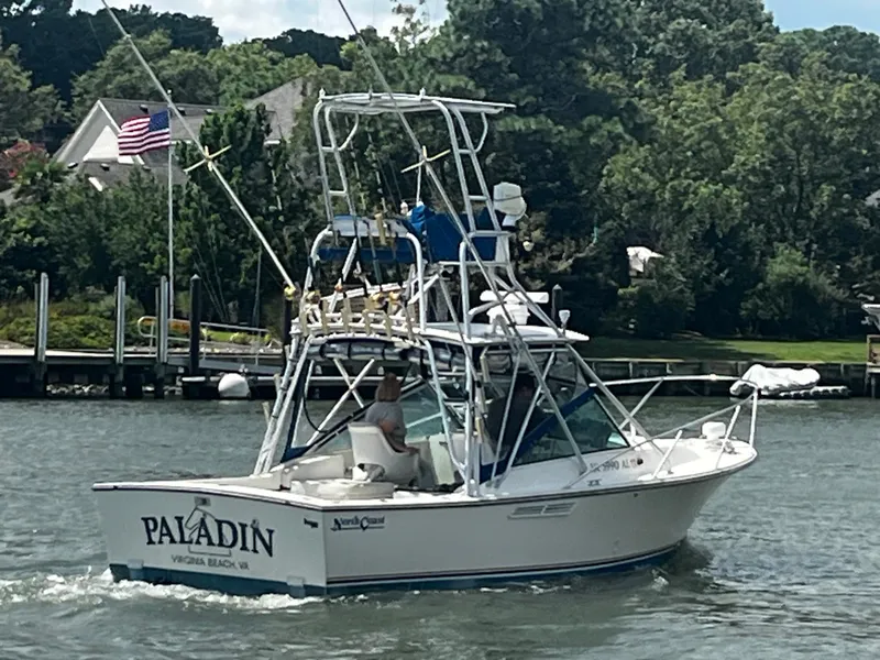 Slide: The Image of 1988 NorthCoast 24 Express Sportfish boat cruising on a scenic waterway. - 4
