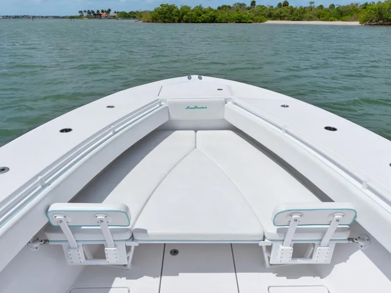 Slide: The Image of Bow seating area of 2017 SeaHunter 45 Tournament boat on calm water. - 22