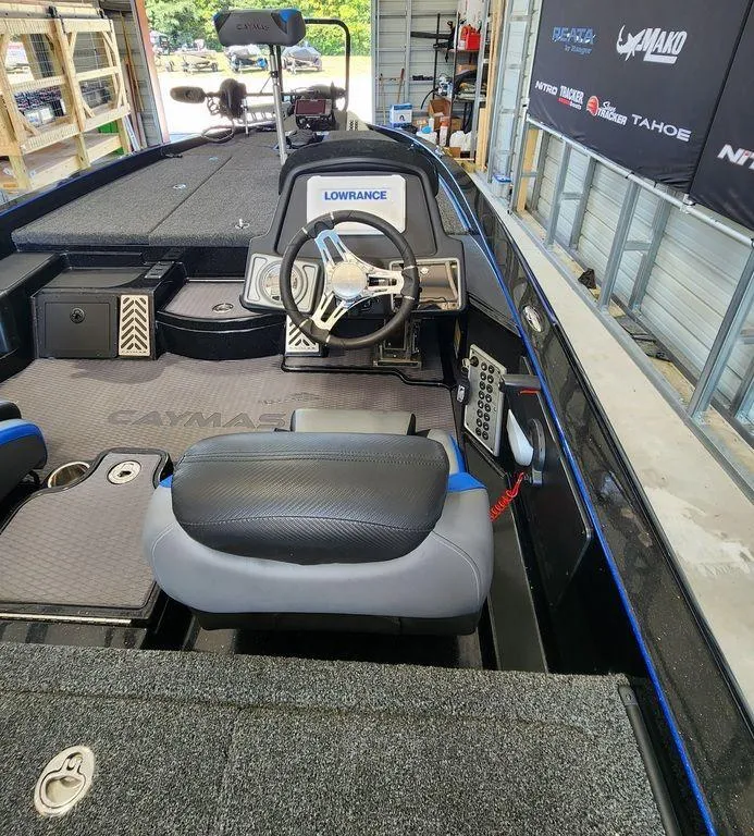 Slide: The Image of 2020 Caymas CX 20 boat interior with steering wheel and Lowrance electronics. - 12