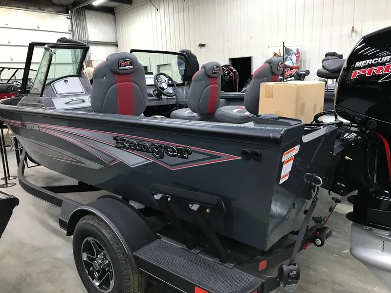 Slide: The Image of 2024 Ranger VS1782SC Angler boat displayed in showroom with trailer. - 3