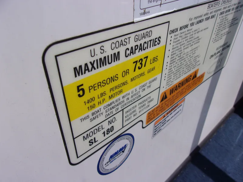 Slide: The Image of U.S. Coast Guard maximum capacities label on 2007 Skeeter SL 180 boat. - 11