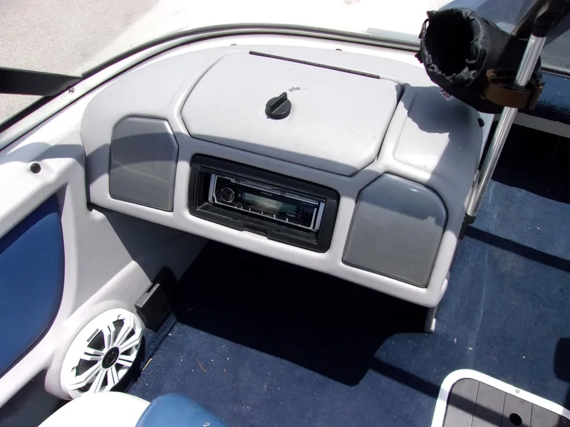 Slide: The Image of 2007 Skeeter SL 180 boat dashboard with stereo system and speaker. - 5