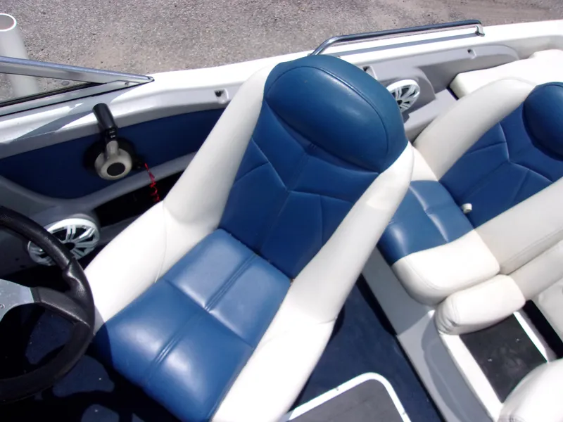 Slide: The Image of 2007 Skeeter SL 180 boat interior with blue and white seats. - 6