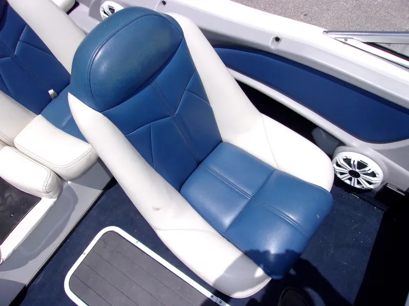 Slide: The Image of 2007 Skeeter SL 180 boat interior with blue and white seats. - 7