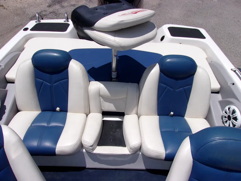 Slide: The Image of 2007 Skeeter SL 180 boat interior with blue and white seats. - 8
