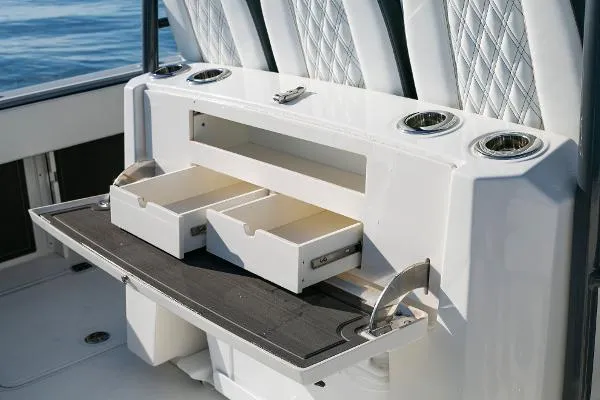 Slide: The Image of 2022 World Cat 400CC-X boat interior with open storage drawers. - 11
