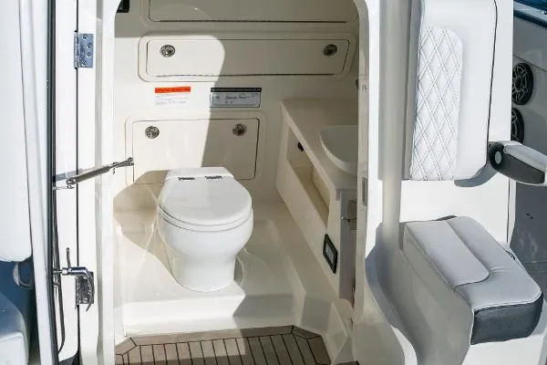 Slide: The Image of 2022 World Cat 400CC-X boat interior with toilet and sink. - 12