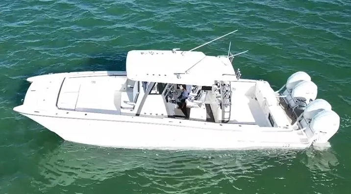 Slide: The Image of 2022 World Cat 400CC-X boat cruising on open water. - 3