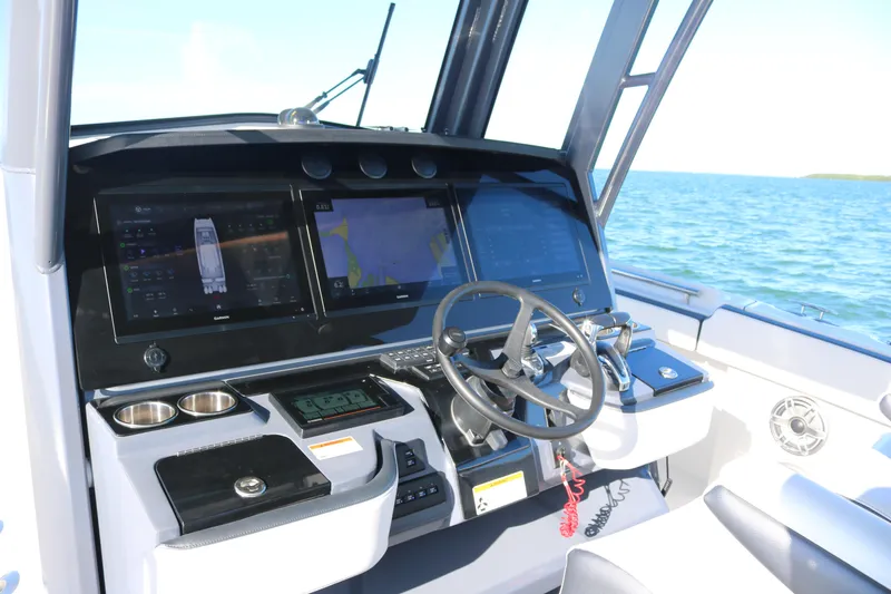 Slide: The Image of 2022 World Cat 400CC-X boat dashboard with advanced navigation systems. - 5