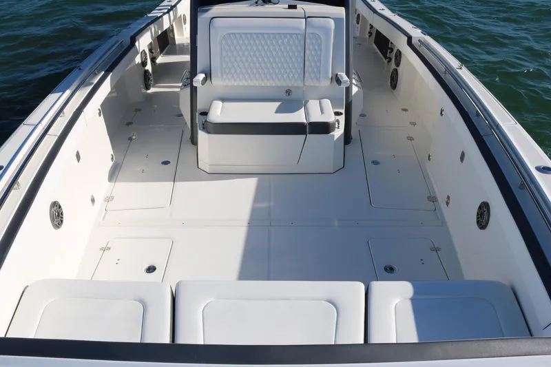 Slide: The Image of 2022 World Cat 400CC-X boat interior with spacious seating and storage compartments. - 7