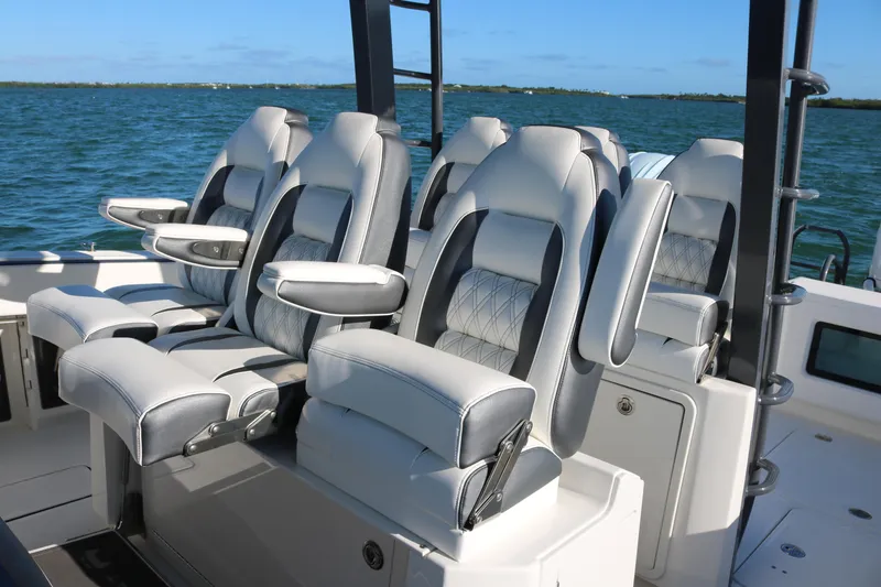 Slide: The Image of Luxury seating on 2022 World Cat 400CC-X boat with ocean backdrop. - 8