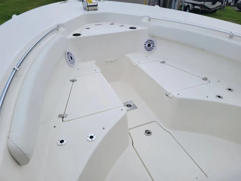 Slide: The Image of 2024 Key West 244 CC boat interior with storage compartments and seating. - 12