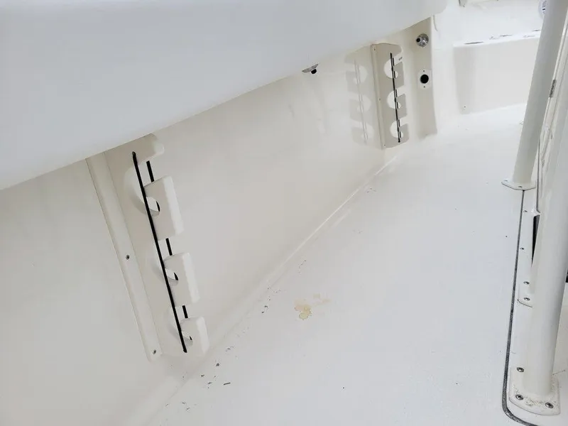 Slide: The Image of 2024 Key West 244 CC boat interior, white deck and storage compartments. - 14