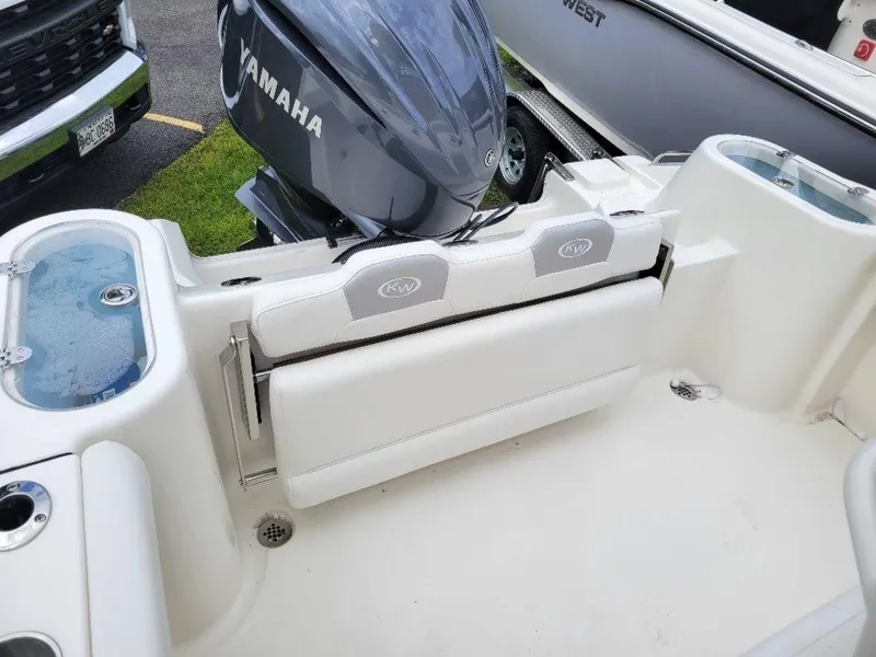 Slide: The Image of 2024 Key West 244 CC boat with Yamaha engine and foldable seating. - 7