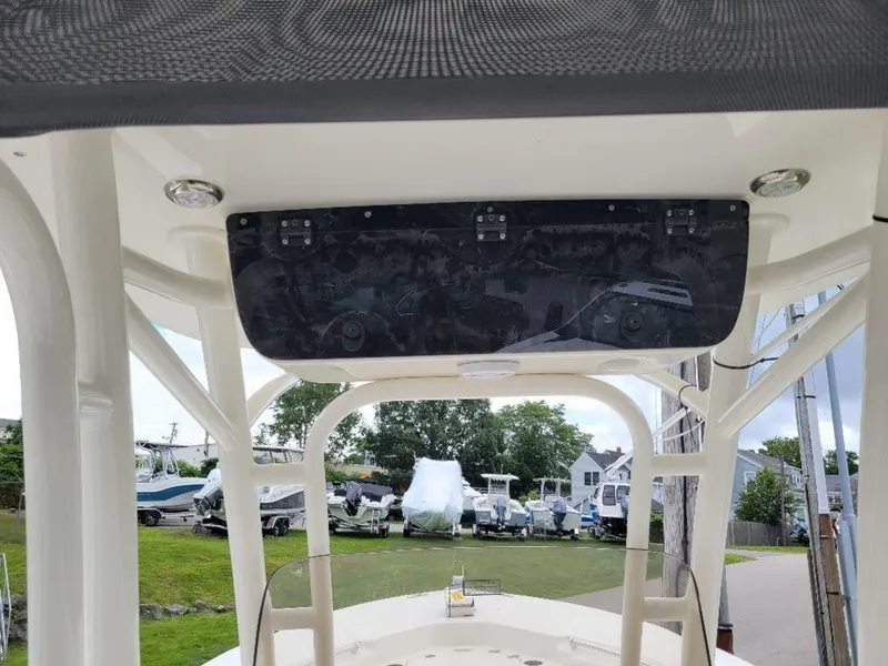 Slide: The Image of 2024 Key West 244 CC boat console with overhead electronics panel. - 8