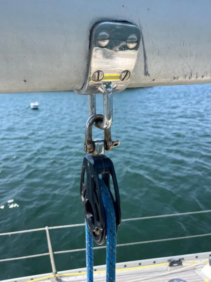 Slide: The Image of Close-up of a Nautor Swan 43 sailboat rigging detail, 1986 model, over water. - 11