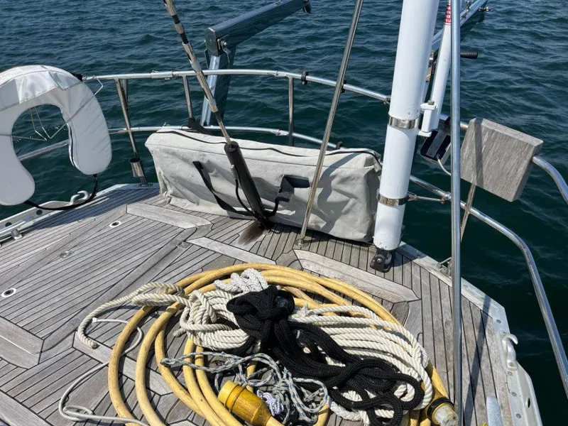 Slide: The Image of Deck of 1986 Nautor Swan 43 sailboat with ropes and life preserver. - 17