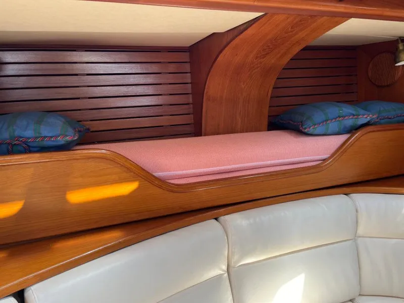 Slide: The Image of Interior of 1986 Nautor Swan 43 yacht with wooden bunk and cushioned seating. - 22