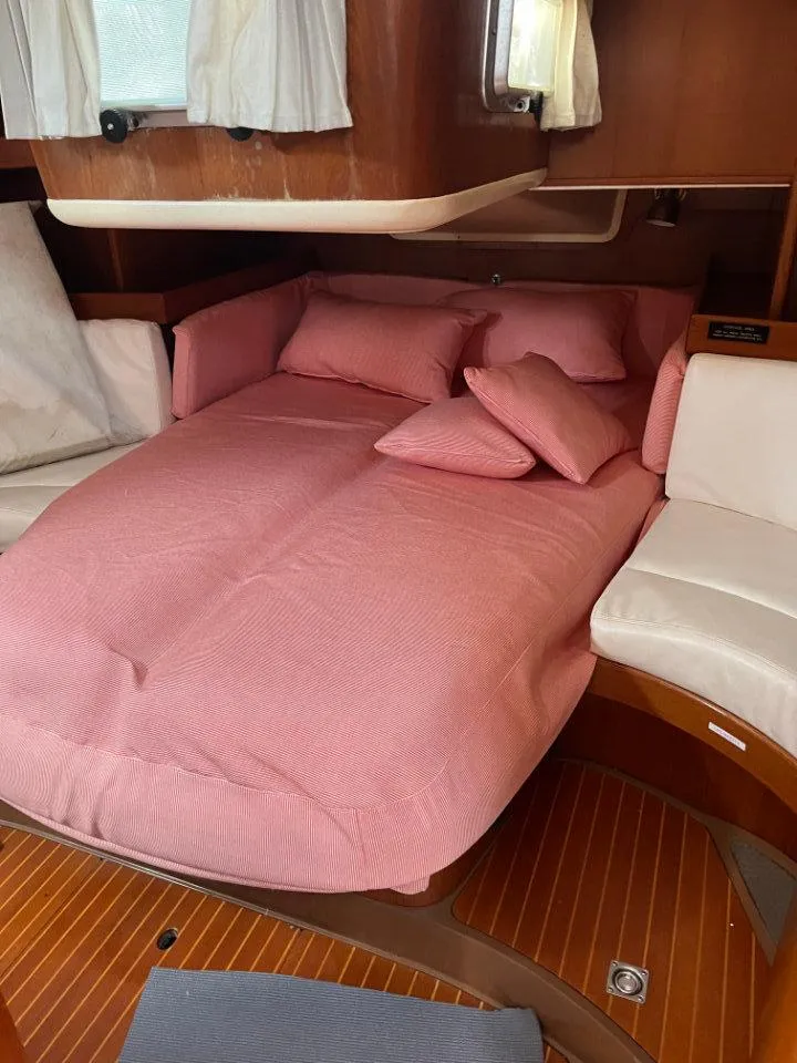 Slide: The Image of Cozy cabin interior of 1986 Nautor Swan 43 yacht with pink bedding. - 27
