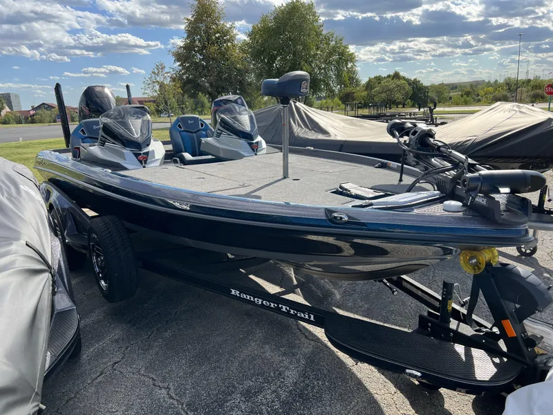 Slide: The Image of 2024 Ranger Z520R boat deck with Lowrance equipment, featuring spacious storage and sleek design. - 2