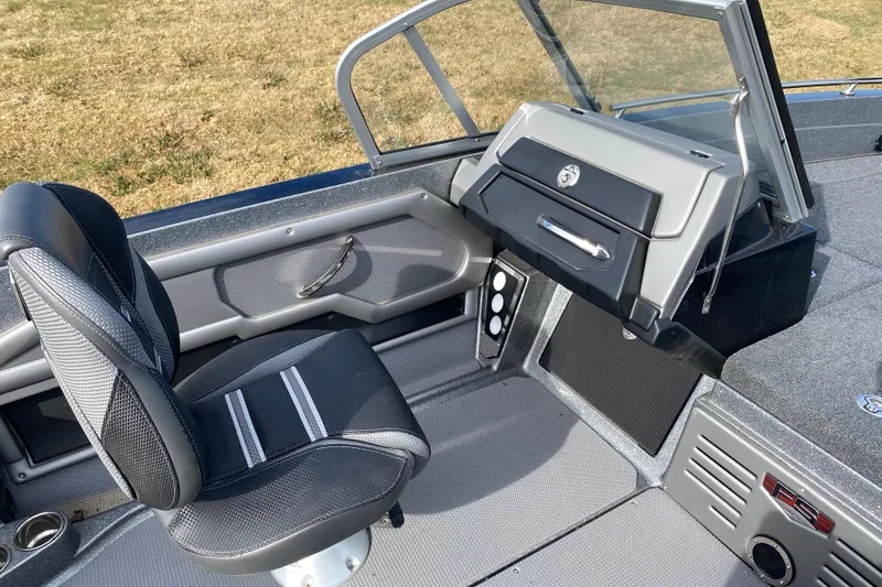 Slide: The Image of 2024 Ranger 621FS Cup-Equipped boat interior with sleek seating and modern dashboard. - 10