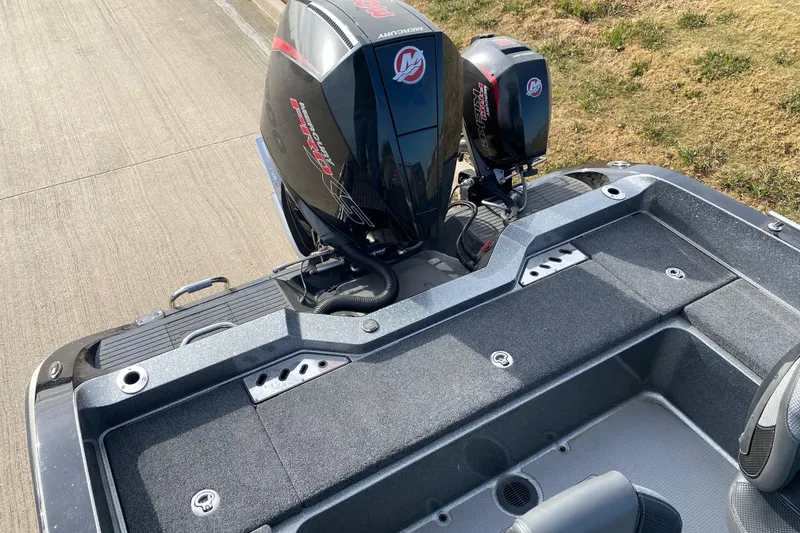 Slide: The Image of 2024 Ranger 621FS Cup-Equipped boat with powerful Mercury outboard engines on a concrete surface. - 12