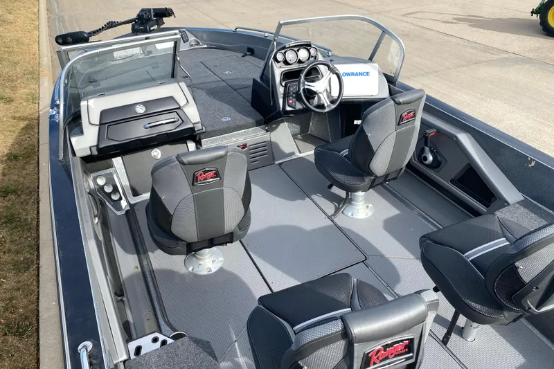 Slide: The Image of 2024 Ranger 621FS Cup-Equipped boat interior with seating and steering console. - 8