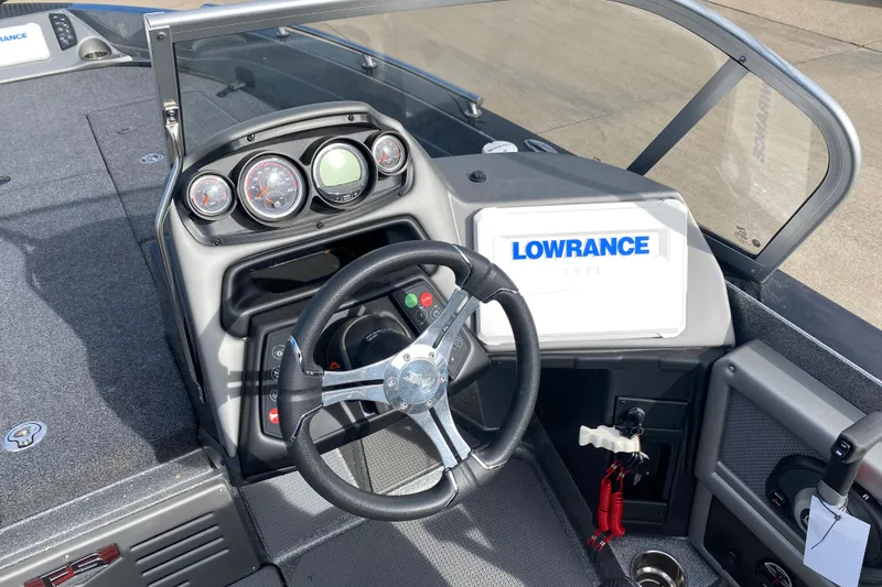 Slide: The Image of 2024 Ranger 621FS Cup-Equipped boat dashboard with Lowrance electronics and steering wheel. - 9