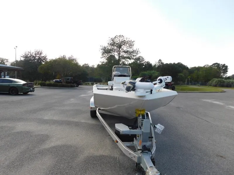 Slide: The Image of 2024 Ranger RB200 boat on a trailer in a parking lot. - 2