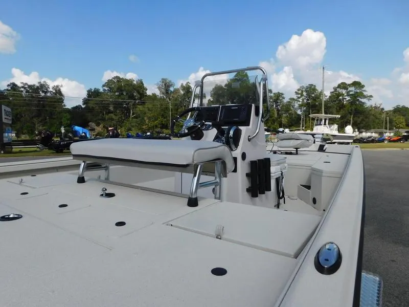 Slide: The Image of 2024 Ranger RB200 boat with center console and seating, docked outdoors. - 6