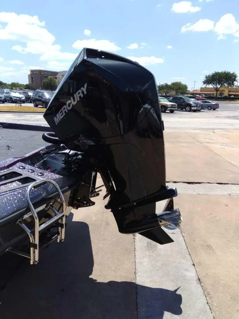 Slide: The Image of 2024 Ranger Z518 boat with Mercury engine displayed in showroom. - 2